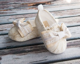 gold and white baby shoes for baptism christening