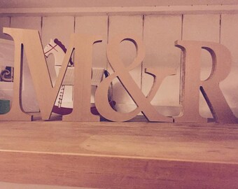 Colourful Painted Freestanding Wooden Letters With Personalised