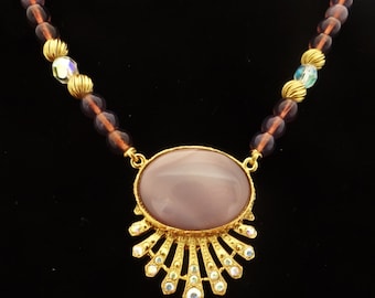 1928 brand Vintage gold tone & glass lavender beaded 20" necklace, attached 1.5" rhinestone and lavender stone pendant in unworn condition