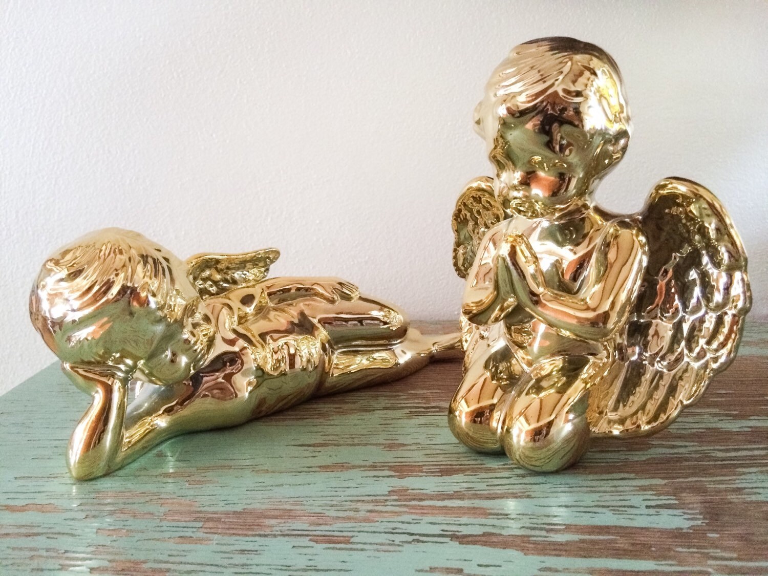 Pair of vintage shiny gold porcelain cherub statues shiny