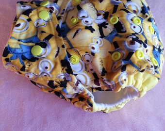 SassyCloth one size pocket diaper with minions packed cotton print. Made to order.