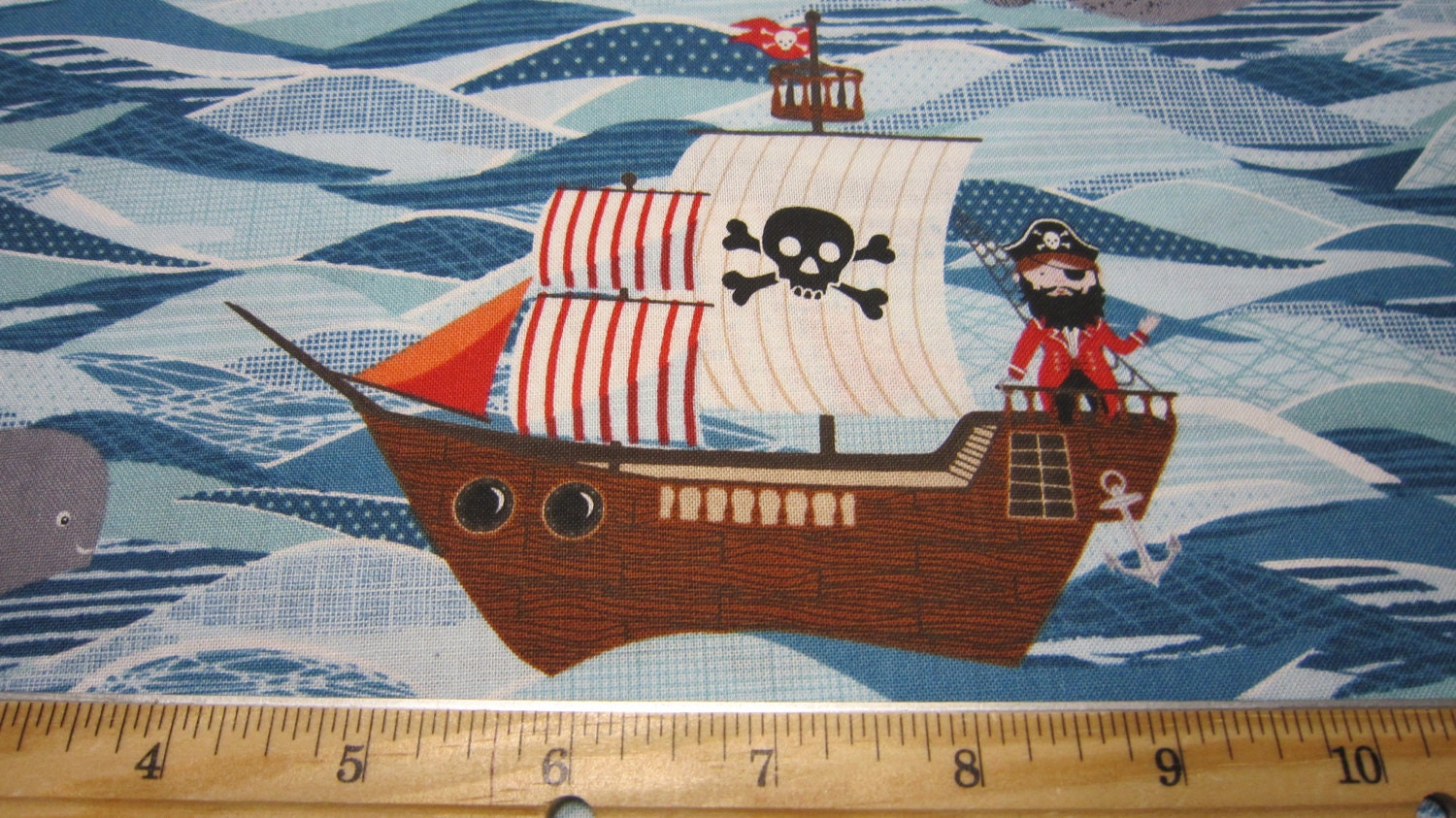 pirate-ships-in-blue-sea-cotton-fabric-designed-by-the-henley-studio