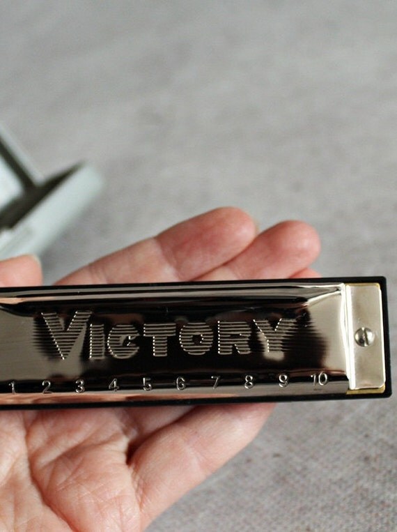Vintage harmonica mouth organ Victory little harmonica in a