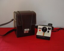Appareil photo Polaroid Land vintage instantané à rayures arc