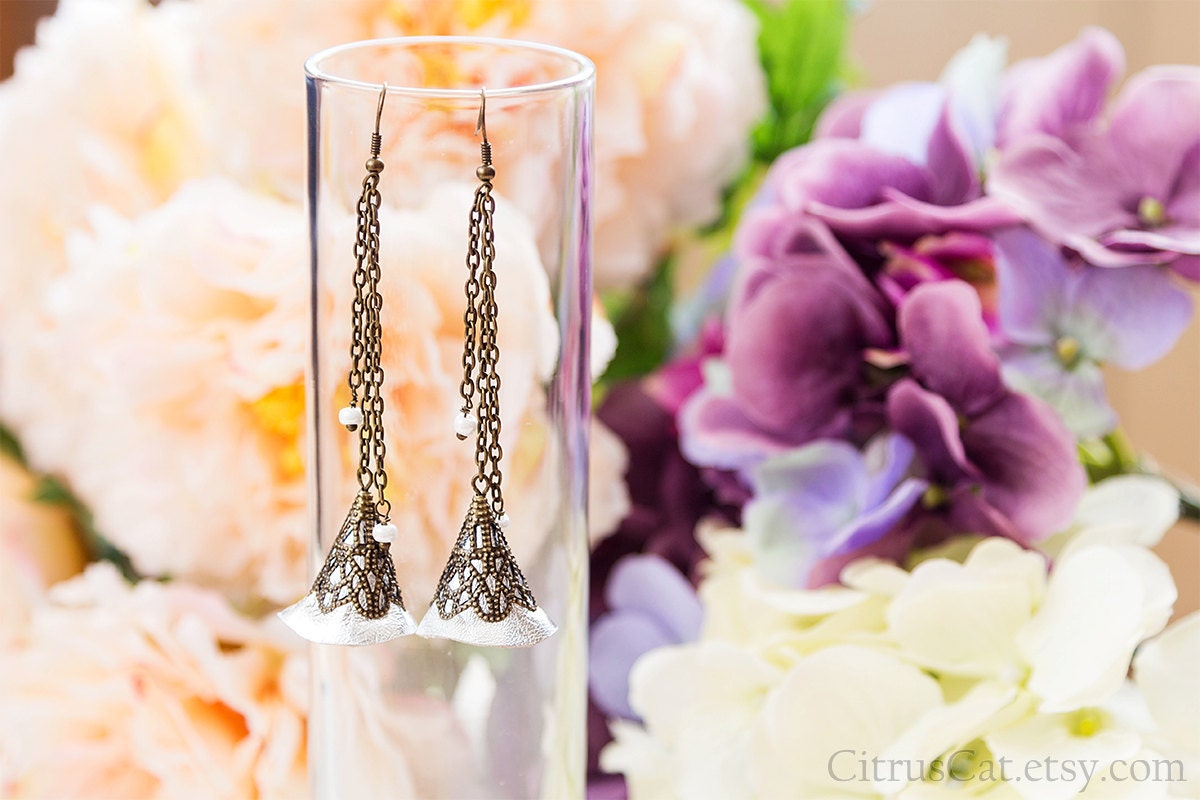 https://www.etsy.com/listing/117532234/silver-bells-long-leather-earrings