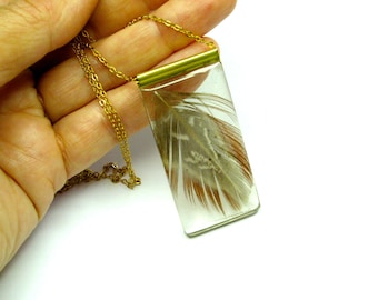 Feather pendant. Plume Resin jewelry. Modern jewelry. Brown and brass. Gold. Feather resin pendant