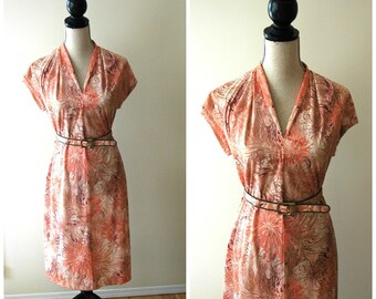 1960's floral day dress with cap sleeve, v neck and belted waist.