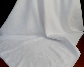 Estate linen damask tablecloth. Art nouveau pattern of blossoms