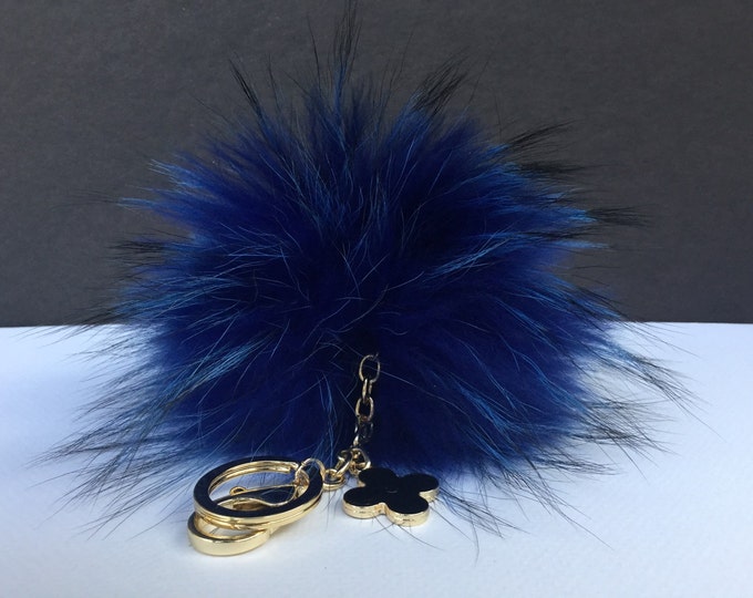 Deep blue with natural markings Raccoon Fur Pom Pom luxury bag pendant + black flower clover charm keychain