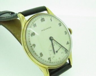 A classic Gents 9ct Gold Movado Watch