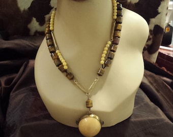 Two strand beaded tiger eye and jade necklaces with vintage drop