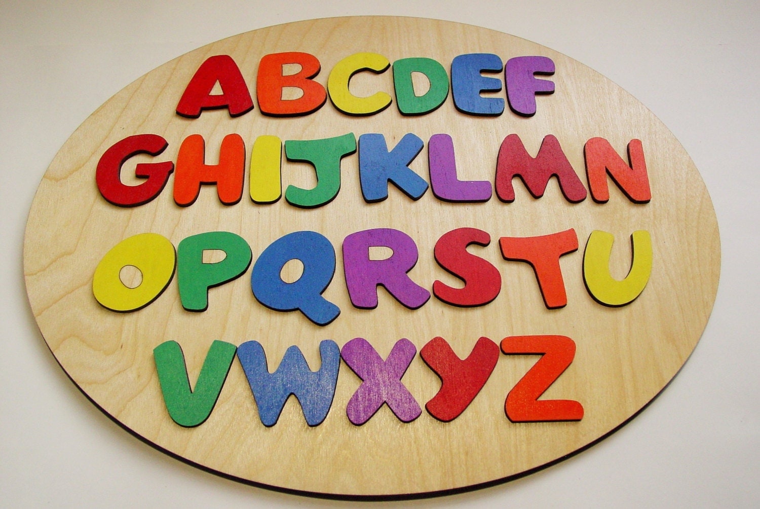 wooden alphabet puzzle with words to spell