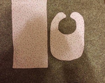 Pink bib and burp cloth set.