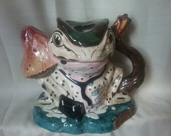 A STAFFORDSHIRE GLAZED REDWARE TEAPOT AND COVER