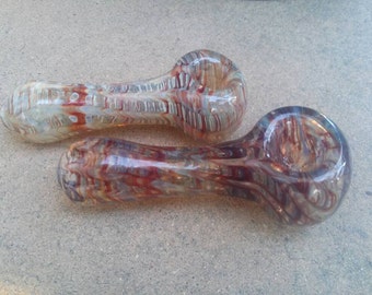 Hand blown glass pipe, wrap and rake spoon.
