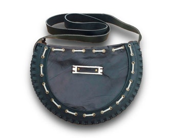 Bag made with bike wheel. Finished leather
