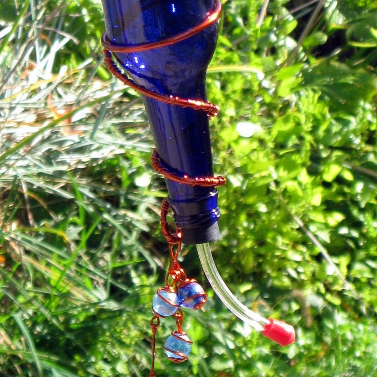 hummingbird feeder with recycled cobalt blue glass bottle hummingbird feeder with recycled cobalt blue glass bottle
