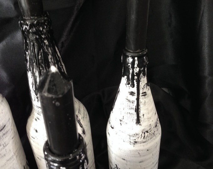 White and black Halloween candle holders, decorative bottles, Halloween decorations