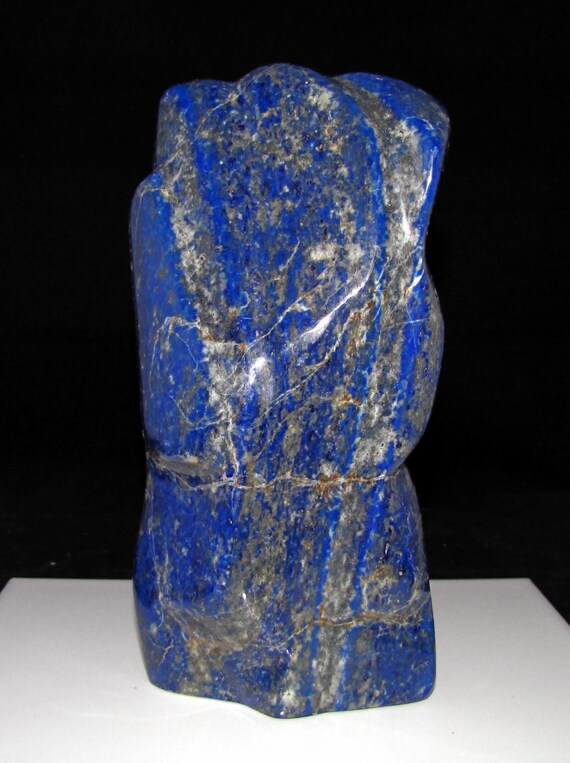 natural smooth polished dark blue lapis lazuli rock stone