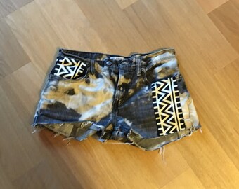 Items similar to faded and distressed Levi 505 with black studs on Etsy