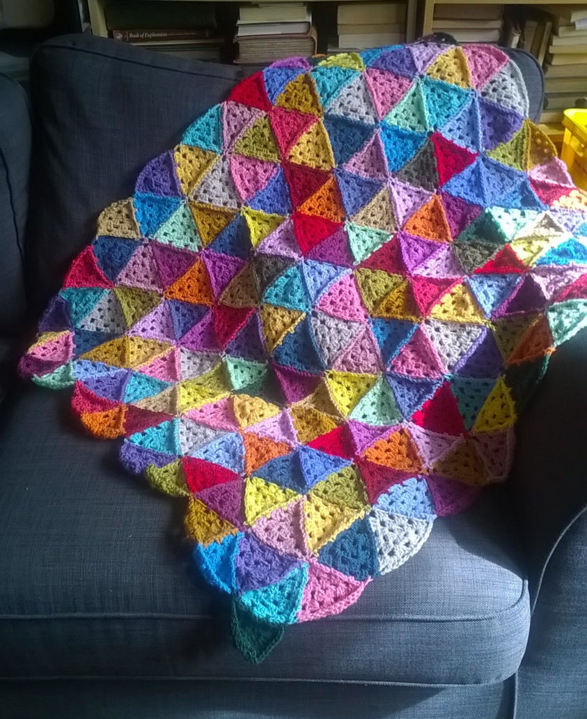 Crocheted granny triangle blanket