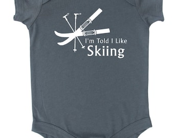 I'm Told I Like Skiing Silhouette Baby Bodysuit