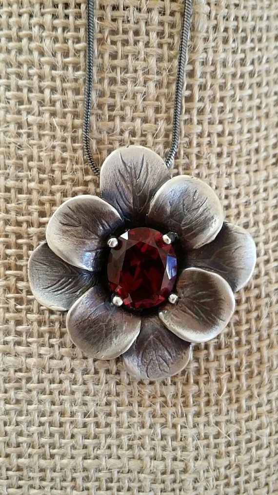 Sterling silver casting pendant with ruby stone.