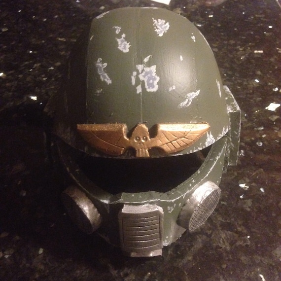 don post imperial guard helmet