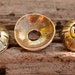 Six Berber Bronze Bead Caps, AD207