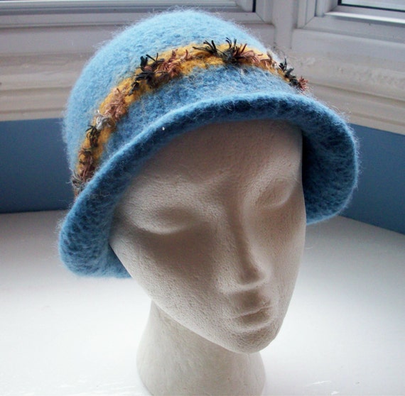 Hand knitted boiled wool felt hat, Downton style, muted mid blue with brown and mustard trim.