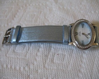 5 Dollar Listing Montres de FLEUR Oval Wristwatch with Rhinestone Trim and Light Blue Wristband