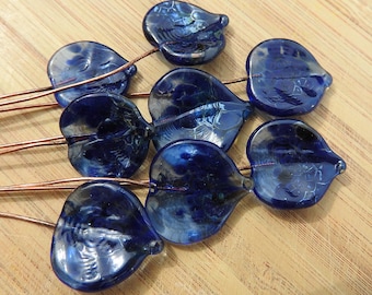 Eight blue lampwork headpins