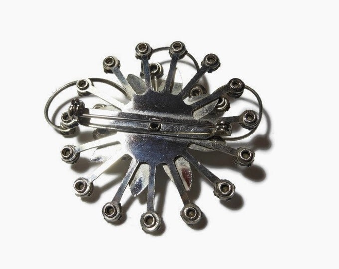 Rhinestone daisy brooch, clear rhinestones, silver tone flower, swirl pinwheel design, 1930s estimated age, faceted prong set