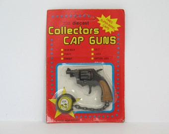 Key Chain Toy Cap Gun Colt Model Unopened 1979 Die Cast Cap Gun