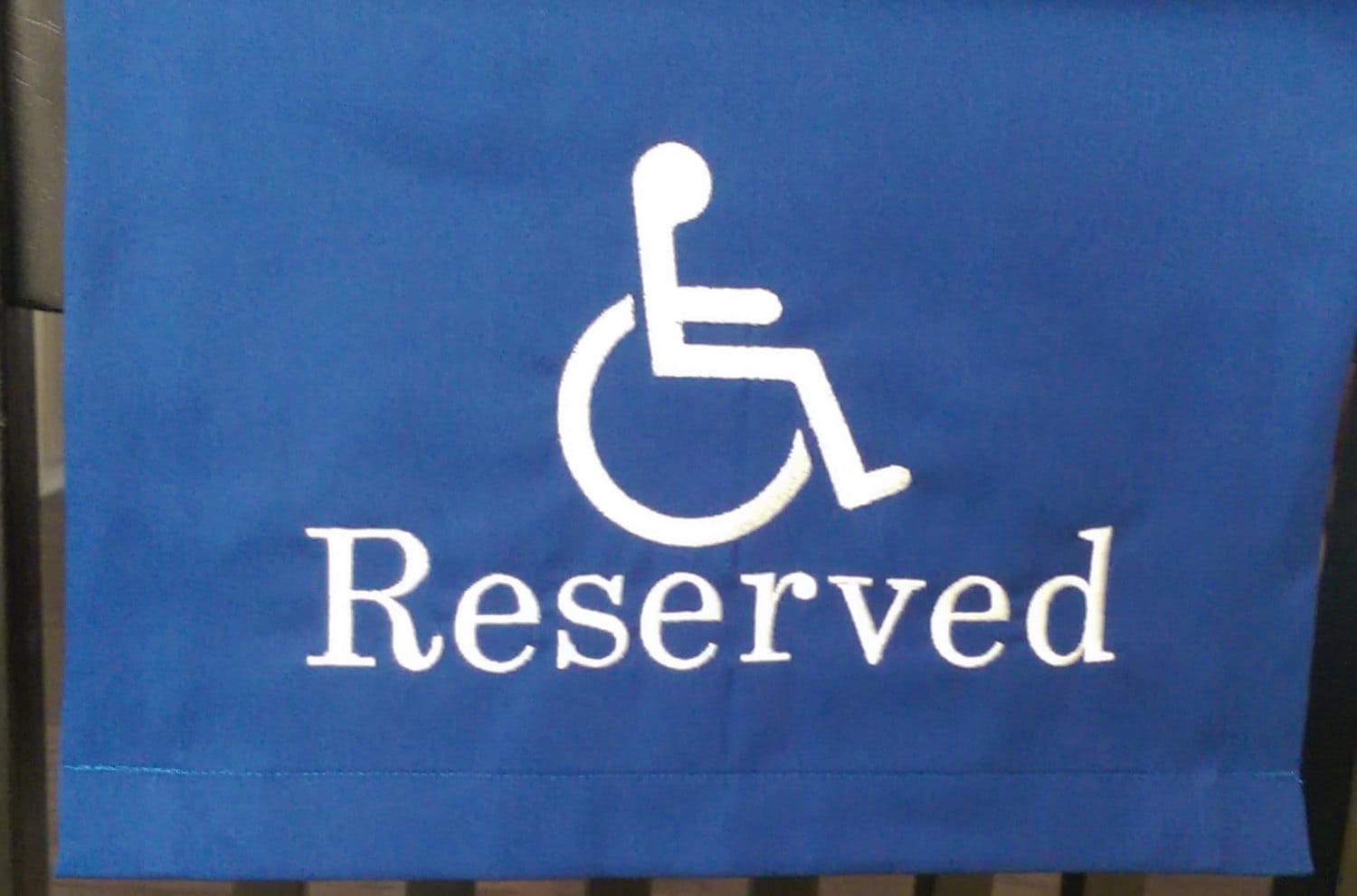 handicap-fabric-sign-to-reserve-seating-in-theater-venue