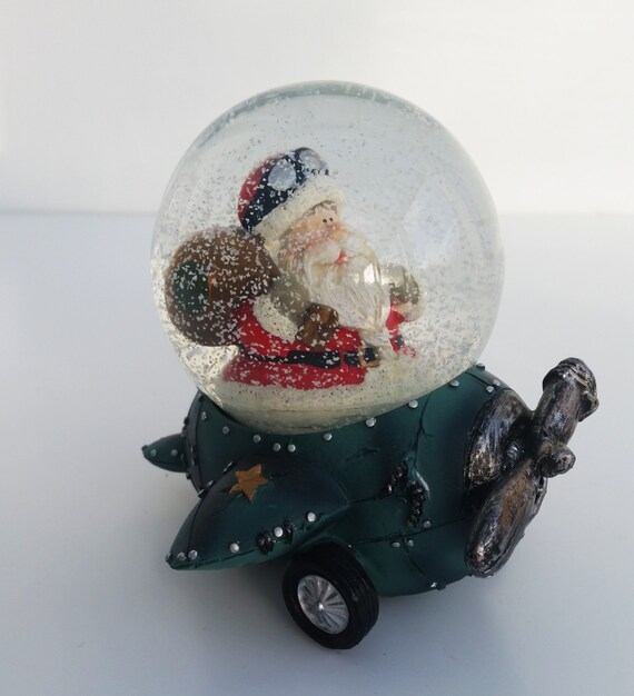 personalised mini snow globe santa in blue plane christmas personalised mini snow globe santa in blue plane christmas