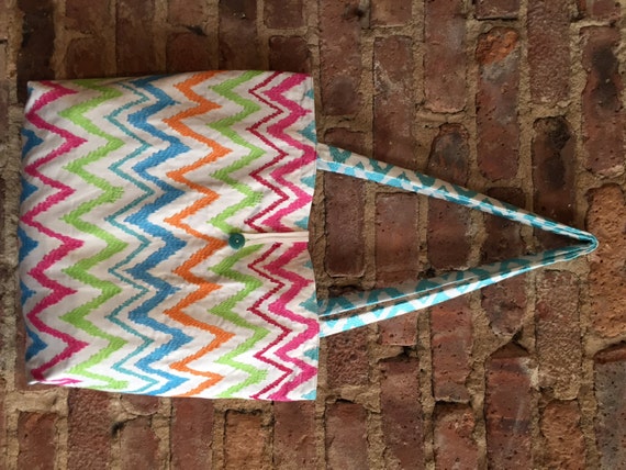 Tote bag with pockets. Roomy, white w colorful embroidered design, roomy tote bag with button and loop closure. Great for beach!