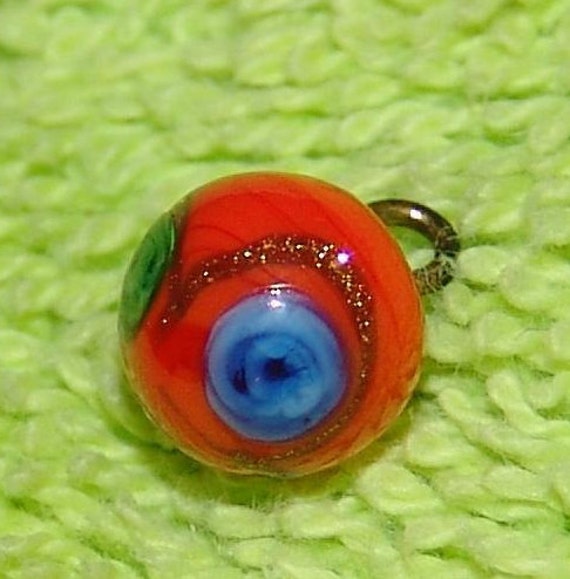 spectacular tiny orange glass ball button overlay of 3 spectacular tiny orange glass ball button overlay of 3