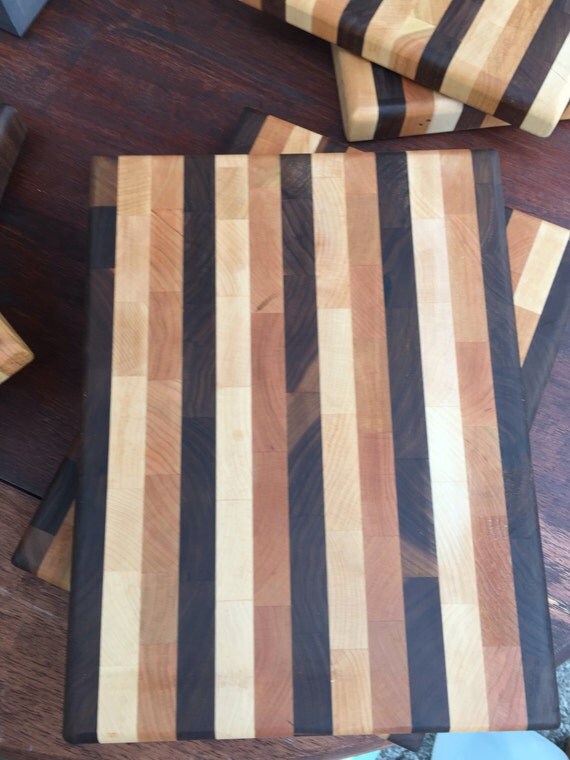 Items similar to Walnut, Maple and Cherry cutting board on Etsy