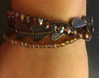 Three strand bracelet with hearts. 7.5"