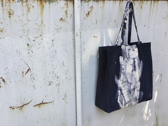 Nero Dash Sausalito - black canvas square tote bag with white dash in the middle by Canzone