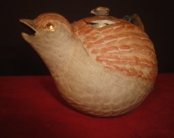 chinese tea pot in the shape of a bird