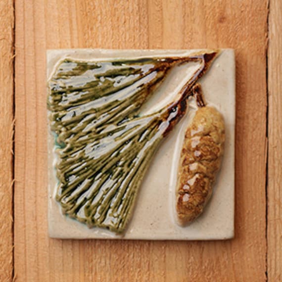 Handmade 4x4 ceramic relief Pine Cone tile comes by SoMiTileworks