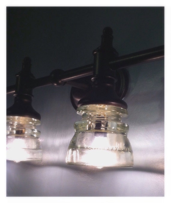 Beautiful Clear Glass Insulator Vanity Light With Bronze