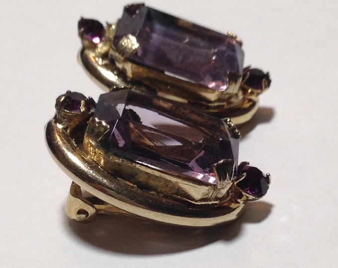 Storewide 25% Off SALE Vintage Gold Tone Oversized Amethyst Purple Rhinestone Designer Clip Earrings Featuring Emerald Cut Design