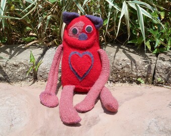 Handmade repurposed sweater monster. Stuffed monster.