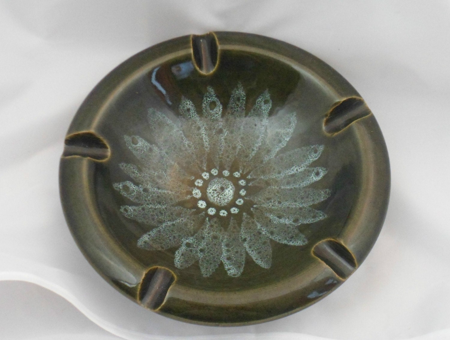 Studio pottery ashtray in earthenware decorated in sage green