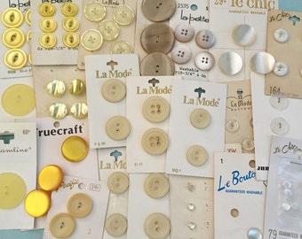 Vintage button cards in yellow and white including glass and mother of pearl La Mode Le Chic Le Bouton button lots