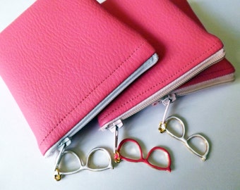 A mini pink pouch with pale pink faux zipper