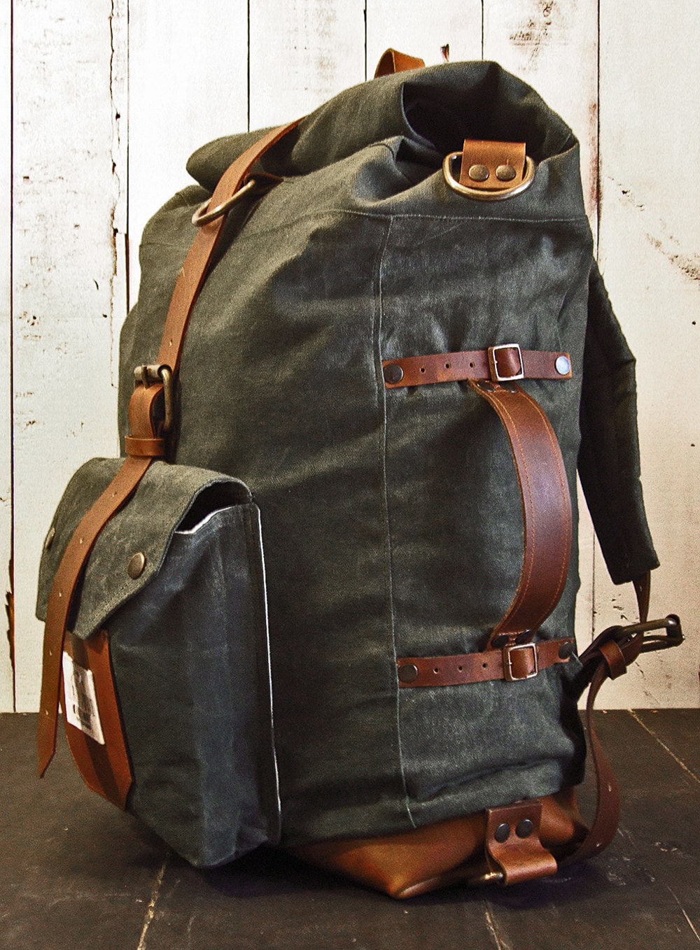 The Nomad II Backpack. Hand waxed canvas leather roll top bag